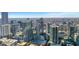 Expansive city view with skyscrapers and lush trees on a clear, sunny day at 855 Peachtree Ne St # 2812, Atlanta, GA 30308