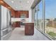 Modern kitchen with stainless steel appliances and an island with amazing city views from the floor to ceiling windows at 855 Peachtree Ne St # 2812, Atlanta, GA 30308