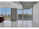 Living area with floor-to-ceiling windows, tile flooring, and city views at 855 Peachtree Ne St # 2812, Atlanta, GA 30308