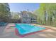 Backyard features a refreshing pool and mature trees at 241 Rose Ridge Dr, Canton, GA 30115