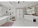Spacious primary bathroom featuring a soaking tub, walk-in shower, and double sink vanity at 241 Rose Ridge Dr, Canton, GA 30115