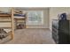 bedroom with a bunk bed, a dresser, and a large window at 241 Rose Ridge Dr, Canton, GA 30115