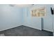 Light blue bedroom featuring a window and blue carpet at 241 Rose Ridge Dr, Canton, GA 30115
