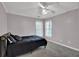 Bedroom with neutral walls, carpeted flooring, and natural light from the windows at 241 Rose Ridge Dr, Canton, GA 30115