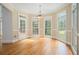 Cozy breakfast nook features hardwood floors, many windows, and access to the outdoor patio at 241 Rose Ridge Dr, Canton, GA 30115