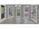 Bright breakfast nook with tile flooring, three windows and views of the pool at 241 Rose Ridge Dr, Canton, GA 30115