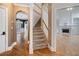 Spacious foyer featuring hardwood floors, stairs to the second floor, and views to the dining room at 241 Rose Ridge Dr, Canton, GA 30115
