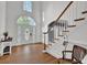 Elegant foyer with hardwood floors, staircase, and plenty of natural light at 241 Rose Ridge Dr, Canton, GA 30115