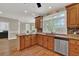 Bright eat-in kitchen features stainless steel appliances, custom cabinetry and trim, and a stainless steel dishwasher at 241 Rose Ridge Dr, Canton, GA 30115
