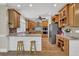 Charming kitchen features granite countertops, stainless steel appliances, and a breakfast bar with seating for casual dining at 241 Rose Ridge Dr, Canton, GA 30115