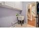 Practical laundry room with utility sink, storage cabinets, and tile flooring at 241 Rose Ridge Dr, Canton, GA 30115