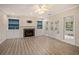 Comfortable living room with fireplace, built-in shelves, and hardwood floors at 241 Rose Ridge Dr, Canton, GA 30115
