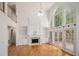 Spacious living room with high ceilings, fireplace, built-ins, and large windows at 241 Rose Ridge Dr, Canton, GA 30115