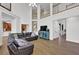 Spacious living room with hardwood floors, soaring ceilings, a staircase to the second floor, and an open concept design at 241 Rose Ridge Dr, Canton, GA 30115