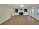 Spacious living room with fireplace, built-in bookshelves, and french doors to the outdoor patio at 241 Rose Ridge Dr, Canton, GA 30115