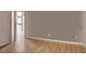 Inviting living room with hardwood floors and a view into the kitchen at 241 Rose Ridge Dr, Canton, GA 30115