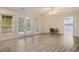 Bright living room featuring wood flooring, and French doors at 241 Rose Ridge Dr, Canton, GA 30115