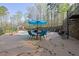 Outdoor pool area features an in-ground pool, an outdoor dining table, and lounge chairs at 241 Rose Ridge Dr, Canton, GA 30115