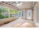 Sunroom with lots of windows overlooking the pool and backyard area at 241 Rose Ridge Dr, Canton, GA 30115