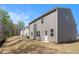 Exterior view of the home's backyard, showcasing the patio area and landscaping at 400 Paulownia Cir, Mcdonough, GA 30253