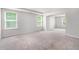 Spacious bedroom with neutral carpet, ample natural light and large windows at 400 Paulownia Cir, Mcdonough, GA 30253