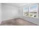 Neutral carpeted bedroom with windows and natural light at 400 Paulownia Cir, Mcdonough, GA 30253