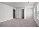 Clean bedroom features neutral carpet, a closet, and ample natural light at 400 Paulownia Cir, Mcdonough, GA 30253