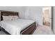Bright bedroom features soft carpet and a comfortable bed with stylish pillows at 400 Paulownia Cir, Mcdonough, GA 30253