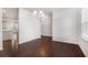 Bright dining area featuring hardwood floors and a modern chandelier fixture at 400 Paulownia Cir, Mcdonough, GA 30253