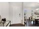 Bright foyer featuring hardwood floors, chandelier, and an open view to the dining room at 400 Paulownia Cir, Mcdonough, GA 30253