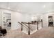 Upstairs hallway with view into the bedroom, living area and laundry room at 400 Paulownia Cir, Mcdonough, GA 30253