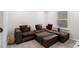 Comfortable living room features a sectional sofa with a throw blanket at 400 Paulownia Cir, Mcdonough, GA 30253
