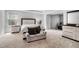 Spacious primary bedroom with a sitting area, complemented by neutral tones and ample natural light at 400 Paulownia Cir, Mcdonough, GA 30253