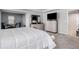 Well-lit main bedroom with a view into a sitting area and dresser at 400 Paulownia Cir, Mcdonough, GA 30253