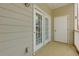 Spacious private balcony with a door and large windows with blinds at 8020 Woodland Ln, Alpharetta, GA 30009