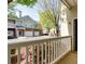 Townhome with brick and vinyl siding boasts an attached one car garage at 8020 Woodland Ln, Alpharetta, GA 30009