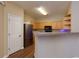Kitchen features stainless steel appliances, wood cabinets, and laminate flooring at 8020 Woodland Ln, Alpharetta, GA 30009