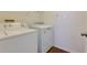 Functional laundry room with a washer and dryer for convenience at 8020 Woodland Ln, Alpharetta, GA 30009