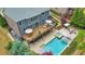 Aerial view of the backyard, showcasing the pool, spa, deck, and outdoor living spaces at 1438 Kings Park Nw Dr, Kennesaw, GA 30152