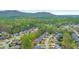 Spacious homes in a lush, green neighborhood nestled amidst rolling hills and mature trees at 1438 Kings Park Nw Dr, Kennesaw, GA 30152