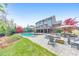 A spacious backyard features a pool, spa, fire pit, and seating areas for outdoor enjoyment at 1438 Kings Park Nw Dr, Kennesaw, GA 30152