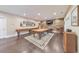 Spacious finished basement featuring a pool table, hardwood floors, and a decorative accent wall at 1438 Kings Park Nw Dr, Kennesaw, GA 30152