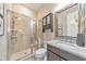 Bathroom featuring a glass-enclosed shower, granite countertop, and modern fixtures, creating a spa-like experience at 1438 Kings Park Nw Dr, Kennesaw, GA 30152