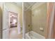 Bathroom with a tub and shower, partially visible through an open door from the hallway at 1438 Kings Park Nw Dr, Kennesaw, GA 30152