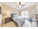 Cozy bedroom with a neatly made bed, stylish furnishings, and natural light from a window at 1438 Kings Park Nw Dr, Kennesaw, GA 30152