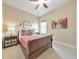 Bedroom featuring a warm color palette, natural light, and cozy furnishings, providing a peaceful retreat at 1438 Kings Park Nw Dr, Kennesaw, GA 30152
