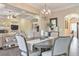 Dining room with elegant lighting, stylish decor, and seamless flow to living spaces at 1438 Kings Park Nw Dr, Kennesaw, GA 30152
