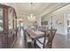 Spacious dining room with a large table, exquisite chandelier, and stylish decor at 1438 Kings Park Nw Dr, Kennesaw, GA 30152