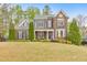 Charming two-story brick home with well-maintained landscaping and inviting curb appeal at 1438 Kings Park Nw Dr, Kennesaw, GA 30152