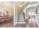 Grand foyer with hardwood floors, staircase, and elegant details leading into the living spaces at 1438 Kings Park Nw Dr, Kennesaw, GA 30152
